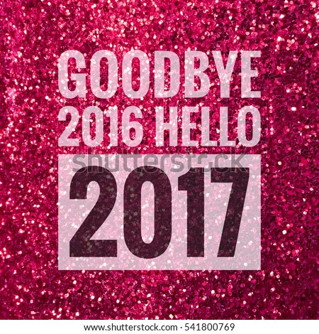 Goodbye 2016 hello 2017 words on shiny pink glitter background