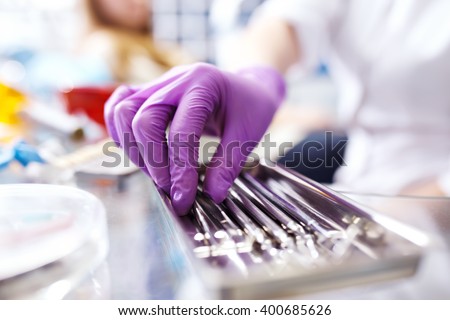 dental instruments. Dental tools in your hand. Professional woman dentist doctor working. .