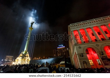 Kiev, Ukraine, 20 February 2015: The statue of Goddess Bereginya is illuminated by lights placed where activists were killed during anti-government protest one year ago is seen on Maidan Nezalezhnosti