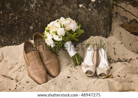 stock photo Wedding Bouquet and shoes on the beach