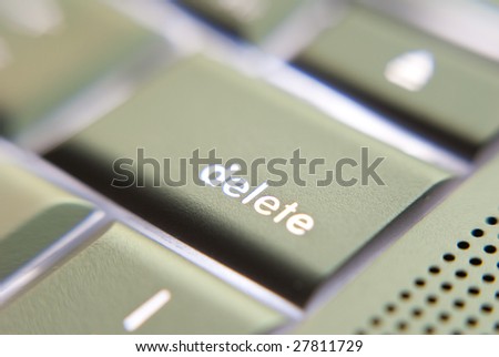 Laptop keyboard with focus on the delete key.