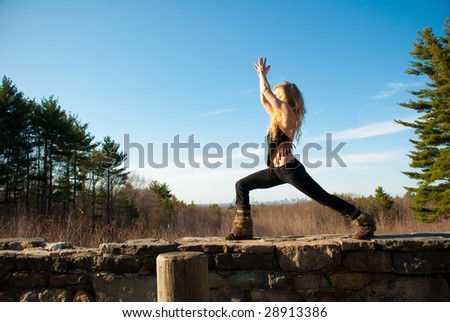 Young woman practicing yoga on a spring afternoon.