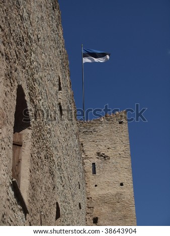 Flag of Estonia in medival Rakvere Castle, Castle walls, flag and blue sky