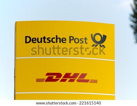 BERLIN, GERMANY - SEPTEMBER 18: the logo of the brands Deutsche Post and DHL at a delivery point. Deutsche Post DHL is the world's largest courier company.  Berlin, Germany, Europe, sept 18 2014