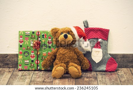 decorative christmas presents (teddy bear with santa hat, boxed gift and stocking), vintage style