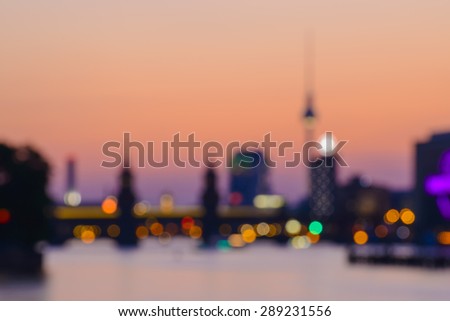 abstract blurred background of Berlin with TV Tower, Oberbaumbruecke and Spree River at evening, Germany, Europe
