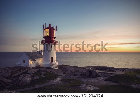 Lighthouse Lindesnes Fyr at sunset on most southern point of Norway, Europe, Vintage filtered style
