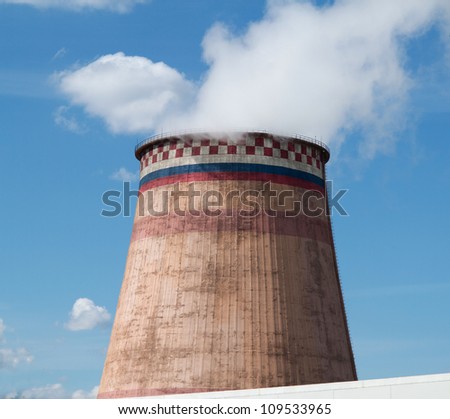 A power station cooling tower contaminating the environment