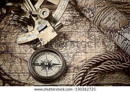 old map and cooper compass with cord