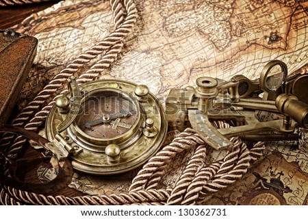 old map and cooper compass with cord