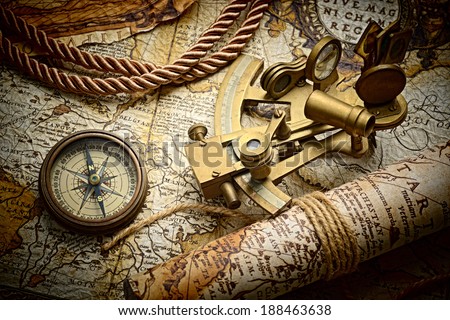 vintage still life with compass,sextant and old map.map used for background is in Public domain. Map source: Library of Congress. Country: Belgium Year: 1570. Author: Abraham Ortelius (1527-1598)