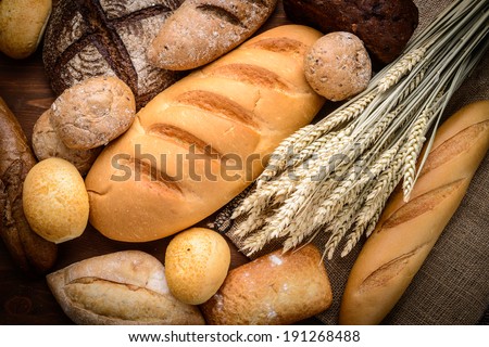 fresh bread and wheat on the wooden