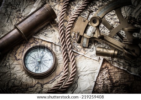 vintage  still life with compass ,sextant ,spyglass ,and old map