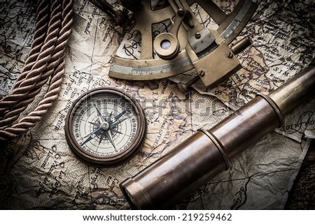 vintage  still life with compass ,sextant ,spyglass ,and old map.