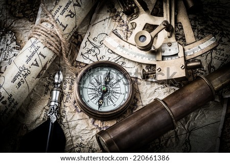 vintage  still life with compass,sextant spyglass and old map