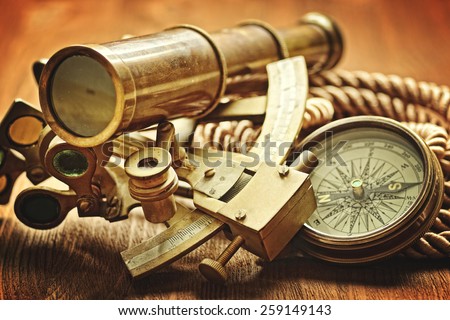 vintage  still life with compass,sextant and spyglass