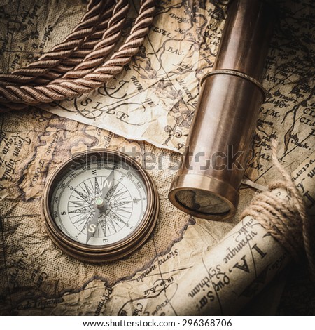 vintage still life with compass,spyglass and old map