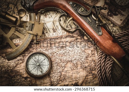 vintage  still life with compass,sextant and pistol