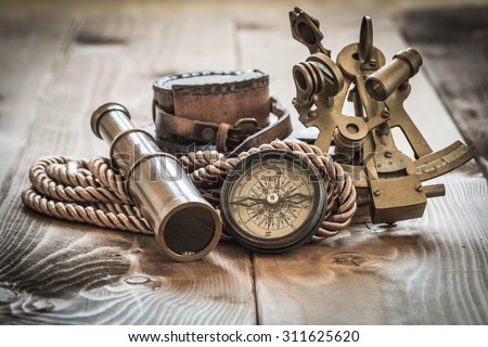 vintage still life with compass,sextant and spyglass