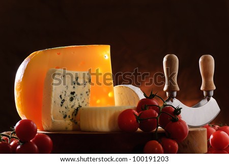 composition with cherry tomatoes and various types of cheese