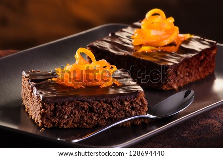 Homemade Chocolate Brownie On A Dark Plate Against A Dark Background