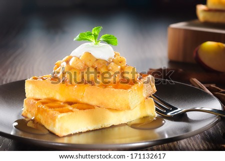 waffles with diced apple cooked, cinnamon, caramel syrup and yogurt topping