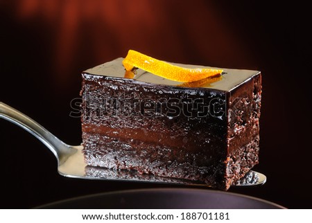 Piece of dark chocolate cake on a spatula