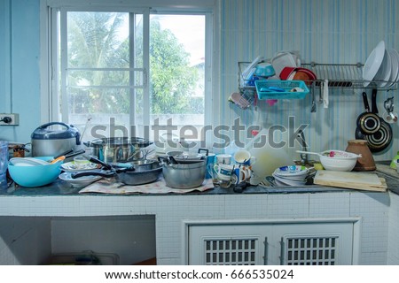 Dirty kitchen, Should be cleaned. Pile of dirty dishes in the kitchen.