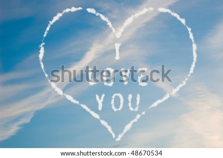 The letters I love you written with cloud letters surrounded by a heart.