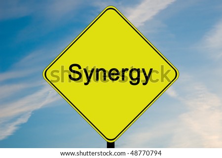 A yellow and black road sign with the word Synergy