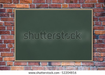 A blank blackboard against a brick wall.