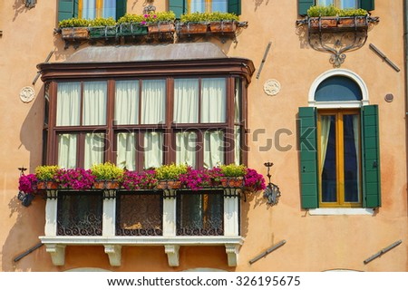 Vintage house with a decorated balcony