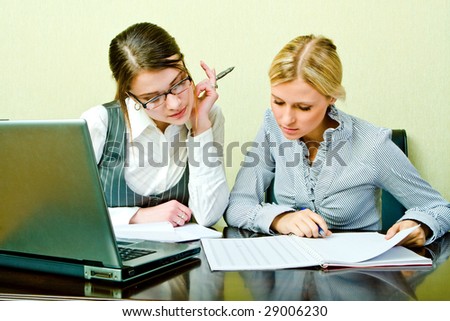 Two womans work in team