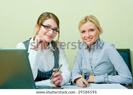 Two womans work in team