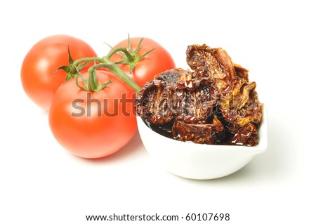 Sun-dried tomatoes steeped in olive oil, white background