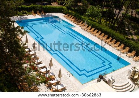 Beautiful hotel swimming pool in a garden