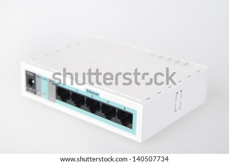 Router network hub with patch cable on a white background
