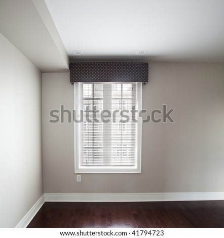 Window covering in bedroom with hardwood floor