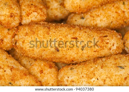Breaded rice sticks fried in canola oil