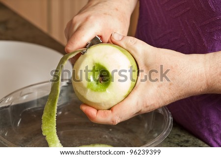 Peeling Granny Smith apples for cooking