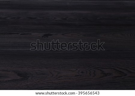 black table top with rough wooden texture. Vintage background