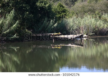 Pond and Dock - An old dock in a pond on a sunny summer day.