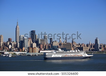NEW YORK - APRIL 29: The cruise ship Veendam passes the Manhattan skyline on April 29, 2012 in New York. The ship has 633 cabins and a crew of over 600.