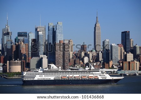 NEW YORK - APRIL 29: The cruise ship Veendam passes the Manhattan skyline on April 29, 2012 in New York. The ship has 633 cabins and crews of over 600.