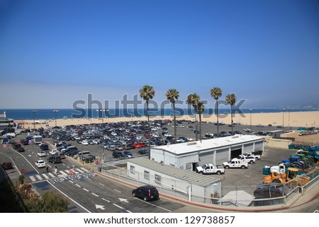 SANTA MONICA, CALIFORNIA - JULY 1: Santa Monica beachgoers and parking on July 1, 2012 in Santa Monica, California. The city has 3.5 miles of beach locations and averages 340 days of sunshine a year.