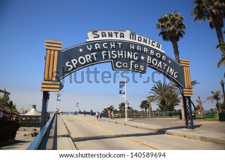 Santa Monica, California - July 1: Beach Goers Stroll Under A Welcoming Arch On July 1, 2012 In Santa Monica, California. The City Has 3.5 Miles Of Beach Locations And 340 Days Of Sunshine A Year.