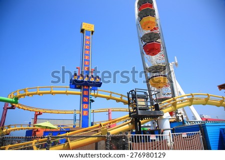 SANTA MONICA, CALIFORNIA - JULY 1: Pacific Park on the Santa Monica pier on July 1, 2012 in Santa Monica, California. The park opened on 1996 and has the world\'s only solar powered Ferris wheel.