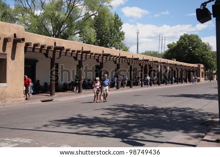 SANTA FE, NEW MEXICO - SEPTEMBER 15: Shoppers and tourists at the Native American market on April 26, 2010 in Santa Fe, New Mexico. The market is held at the Palace of the Governors, built in 1610.