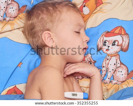 A small child with high fever sleep in bed
