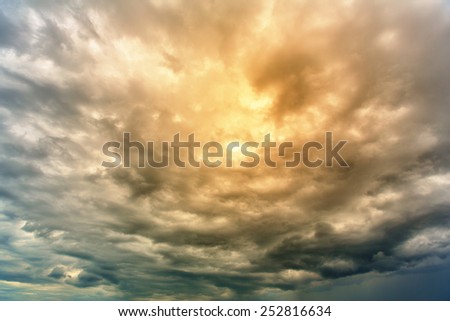 Veil of thunderclouds with warm area in center
